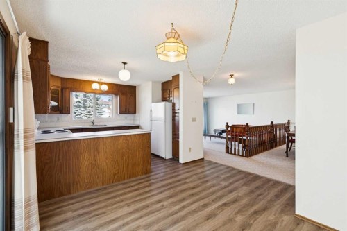 2627 126 Avenue Sw, Calgary, AB - Indoor Photo Showing Kitchen With Double Sink