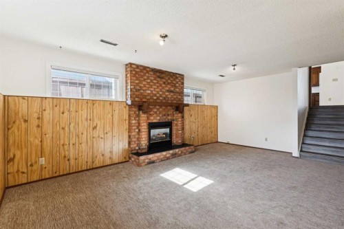 2627 126 Avenue Sw, Calgary, AB - Indoor With Fireplace