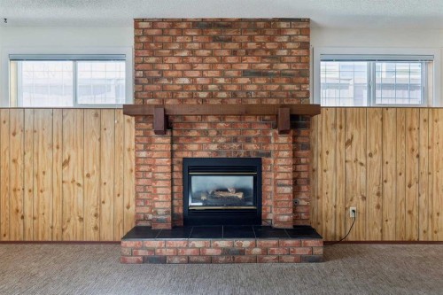 2627 126 Avenue Sw, Calgary, AB - Indoor Photo Showing Living Room With Fireplace