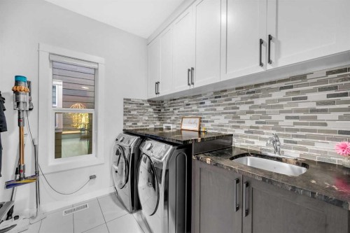 134 Corner Meadows Common Ne, Calgary, AB - Indoor Photo Showing Laundry Room