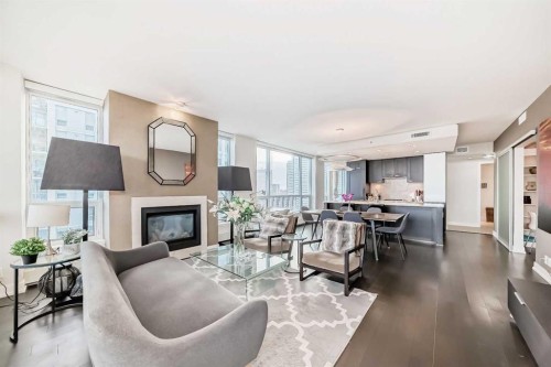 1723-222 Riverfront Avenue Sw, Calgary, AB - Indoor Photo Showing Living Room With Fireplace