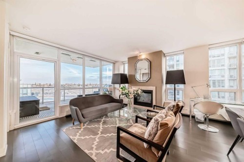 1723-222 Riverfront Avenue Sw, Calgary, AB - Indoor Photo Showing Living Room With Fireplace