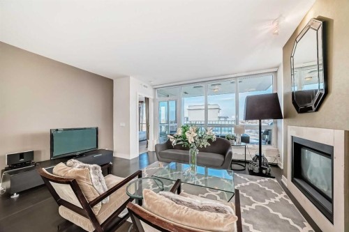 1723-222 Riverfront Avenue Sw, Calgary, AB - Indoor Photo Showing Living Room With Fireplace