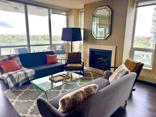 1723-222 Riverfront Avenue Sw, Calgary, AB - Indoor Photo Showing Living Room With Fireplace
