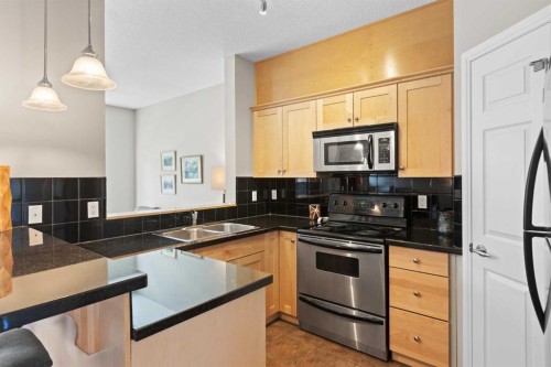 113-80 Dyrgas Gate, Canmore, AB - Indoor Photo Showing Kitchen With Double Sink