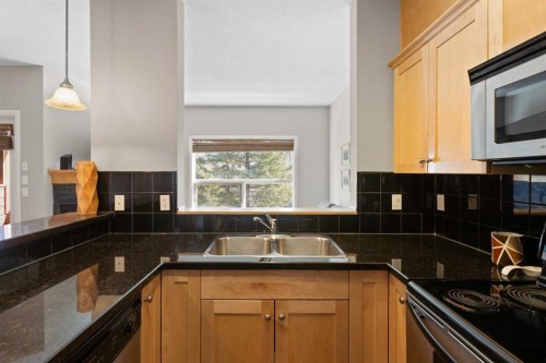 113-80 Dyrgas Gate, Canmore, AB - Indoor Photo Showing Kitchen With Double Sink