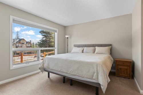 113-80 Dyrgas Gate, Canmore, AB - Indoor Photo Showing Bedroom