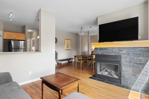 113-80 Dyrgas Gate, Canmore, AB - Indoor Photo Showing Living Room With Fireplace