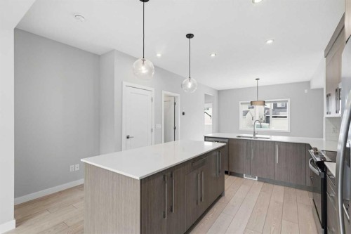 592 Dawson Drive, Chestermere, AB - Indoor Photo Showing Kitchen With Upgraded Kitchen