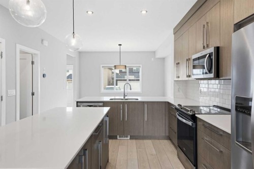 592 Dawson Drive, Chestermere, AB - Indoor Photo Showing Kitchen With Stainless Steel Kitchen With Double Sink With Upgraded Kitchen