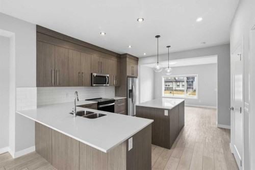 592 Dawson Drive, Chestermere, AB - Indoor Photo Showing Kitchen With Stainless Steel Kitchen With Double Sink With Upgraded Kitchen