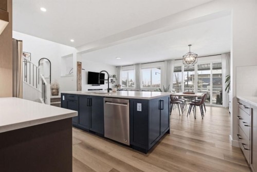 3 Sundown Crescent, Cochrane, AB - Indoor Photo Showing Kitchen With Upgraded Kitchen