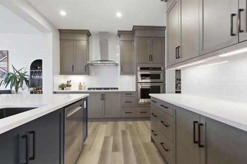 3 Sundown Crescent, Cochrane, AB - Indoor Photo Showing Kitchen With Upgraded Kitchen