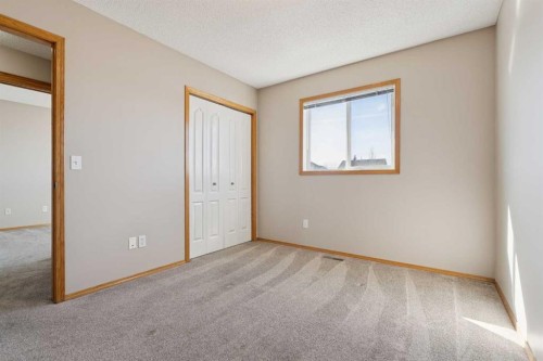 111 Luxstone Crescent Sw, Airdrie, AB - Indoor Photo Showing Other Room