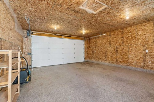 111 Luxstone Crescent Sw, Airdrie, AB - Indoor Photo Showing Garage
