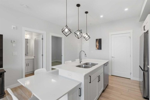 220-400 Auburn Meadows Common Se, Calgary, AB - Indoor Photo Showing Kitchen With Double Sink With Upgraded Kitchen