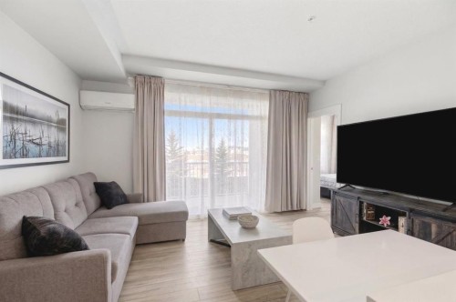 220-400 Auburn Meadows Common Se, Calgary, AB - Indoor Photo Showing Living Room
