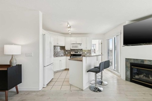 102-6102 Valleyview Park Se, Calgary, AB - Indoor With Fireplace