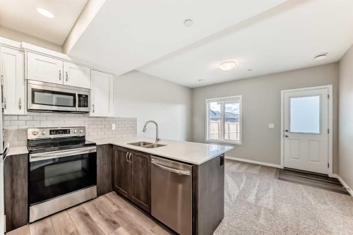35 Lucas Terrace Nw, Calgary, AB - Indoor Photo Showing Kitchen With Double Sink