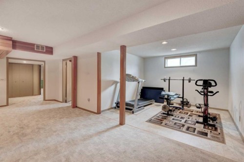 1032 Cantabrian Drive Sw, Calgary, AB - Indoor Photo Showing Gym Room