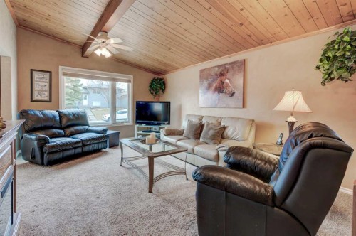 1032 Cantabrian Drive Sw, Calgary, AB - Indoor Photo Showing Living Room