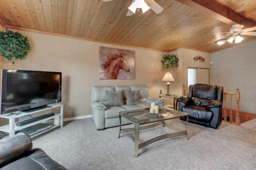 1032 Cantabrian Drive Sw, Calgary, AB - Indoor Photo Showing Living Room
