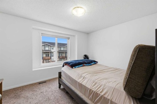98 Panatella Hill Nw, Calgary, AB - Indoor Photo Showing Bedroom