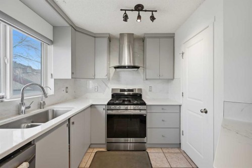 98 Panatella Hill Nw, Calgary, AB - Indoor Photo Showing Kitchen With Double Sink