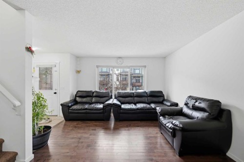 98 Panatella Hill Nw, Calgary, AB - Indoor Photo Showing Living Room