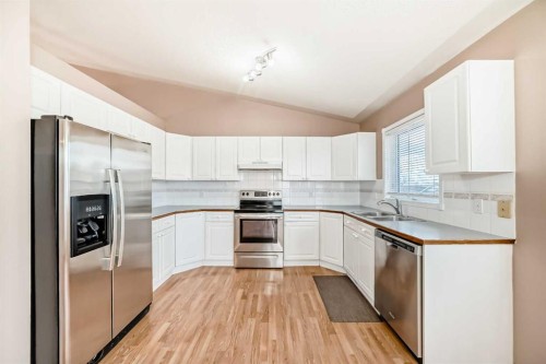 37 Arbour Wood Place Nw, Calgary, AB - Indoor Photo Showing Kitchen With Double Sink