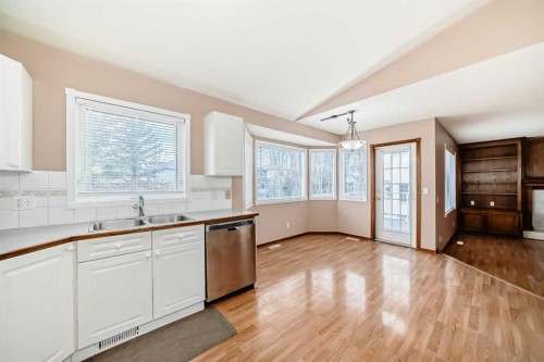 37 Arbour Wood Place Nw, Calgary, AB - Indoor Photo Showing Kitchen With Double Sink