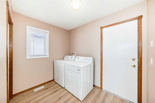 37 Arbour Wood Place Nw, Calgary, AB - Indoor Photo Showing Laundry Room
