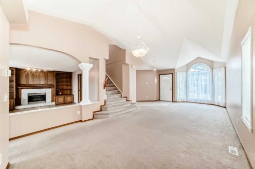 37 Arbour Wood Place Nw, Calgary, AB - Indoor Photo Showing Other Room With Fireplace