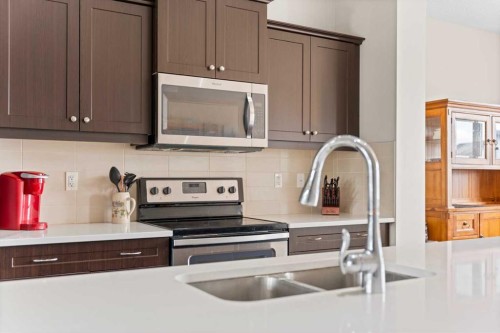 53 Amery Crescent, Crossfield, AB - Indoor Photo Showing Kitchen With Double Sink With Upgraded Kitchen