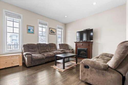 53 Amery Crescent, Crossfield, AB - Indoor Photo Showing Living Room With Fireplace