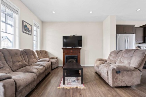 53 Amery Crescent, Crossfield, AB - Indoor Photo Showing Living Room With Fireplace