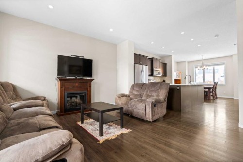 53 Amery Crescent, Crossfield, AB - Indoor Photo Showing Living Room With Fireplace