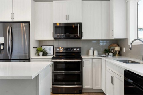 44 Marquis Link Se, Calgary, AB - Indoor Photo Showing Kitchen With Double Sink With Upgraded Kitchen