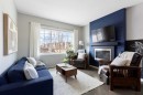 44 Marquis Link Se, Calgary, AB  - Indoor Photo Showing Living Room With Fireplace 