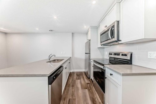 172 Rowmont Boulevard Nw, Calgary, AB - Indoor Photo Showing Kitchen With Stainless Steel Kitchen With Double Sink