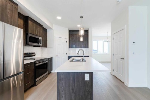 1921 Mccaskill Drive, Crossfield, AB - Indoor Photo Showing Kitchen With Double Sink With Upgraded Kitchen