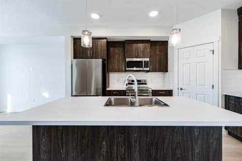 1921 Mccaskill Drive, Crossfield, AB - Indoor Photo Showing Kitchen With Upgraded Kitchen