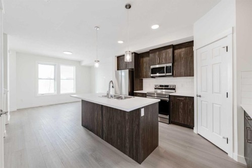 1921 Mccaskill Drive, Crossfield, AB - Indoor Photo Showing Kitchen With Double Sink With Upgraded Kitchen