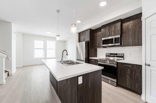 1921 Mccaskill Drive, Crossfield, AB - Indoor Photo Showing Kitchen With Double Sink With Upgraded Kitchen