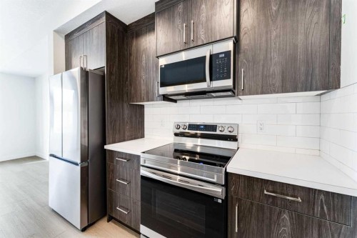 1921 Mccaskill Drive, Crossfield, AB - Indoor Photo Showing Kitchen