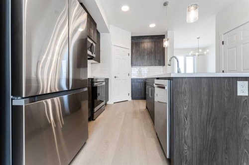 1921 Mccaskill Drive, Crossfield, AB - Indoor Photo Showing Kitchen With Upgraded Kitchen
