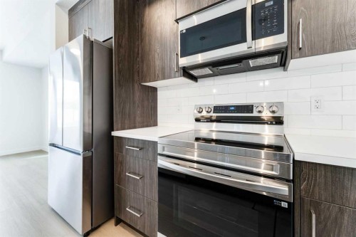 1921 Mccaskill Drive, Crossfield, AB - Indoor Photo Showing Kitchen