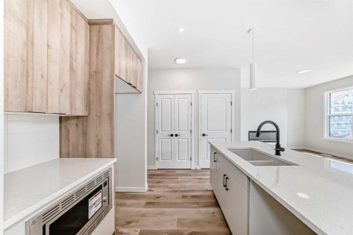1069 Sawgrass Link Nw, Airdrie, AB - Indoor Photo Showing Kitchen With Double Sink