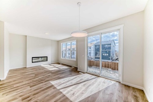 1069 Sawgrass Link Nw, Airdrie, AB - Indoor With Fireplace