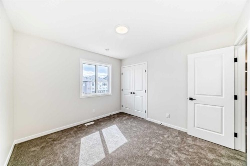 1069 Sawgrass Link Nw, Airdrie, AB - Indoor Photo Showing Other Room